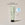 A tube of ACURE volumizing shampoo for fine hair, with a mint green label next to a circle displaying old packaging and a text calling out: New look, same proven formula